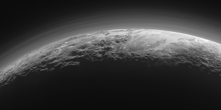 Like Titan, Pluto’s atmosphere is hazy, but for a different reason